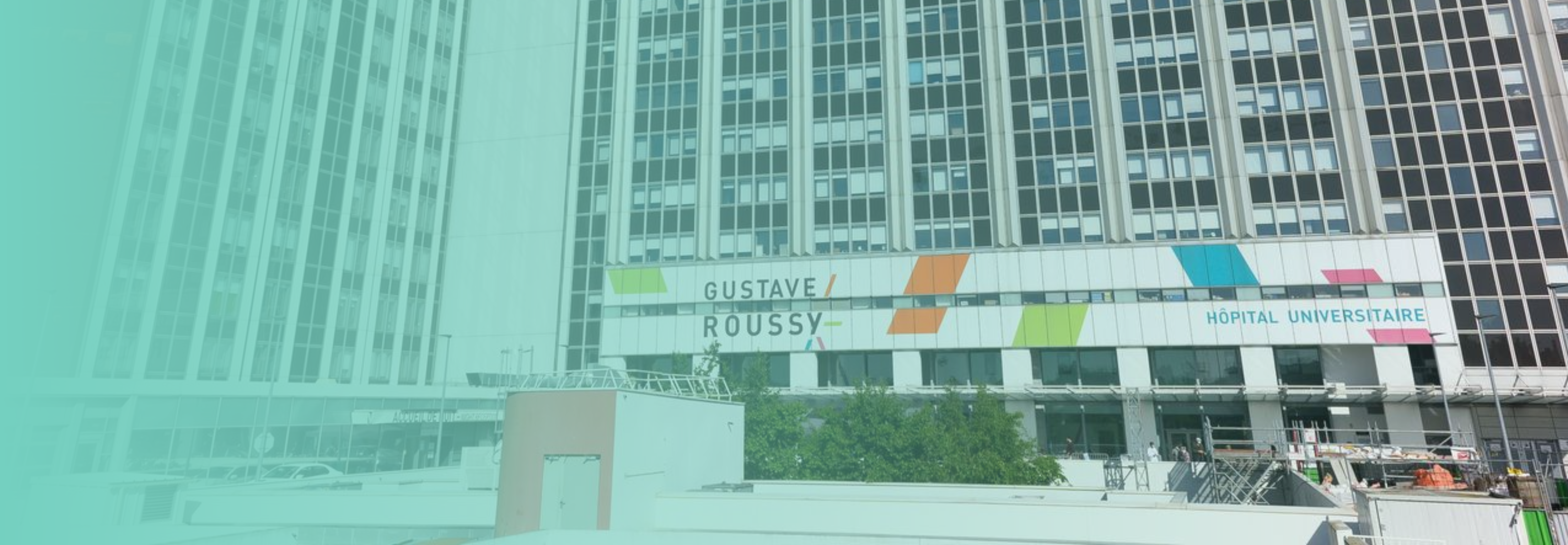 Exterior view of the Gustave Roussy Institute hospital in Villejuif, France, showcasing the modern, expansive 70-hectare campus designed to improve patient and visitor experience.