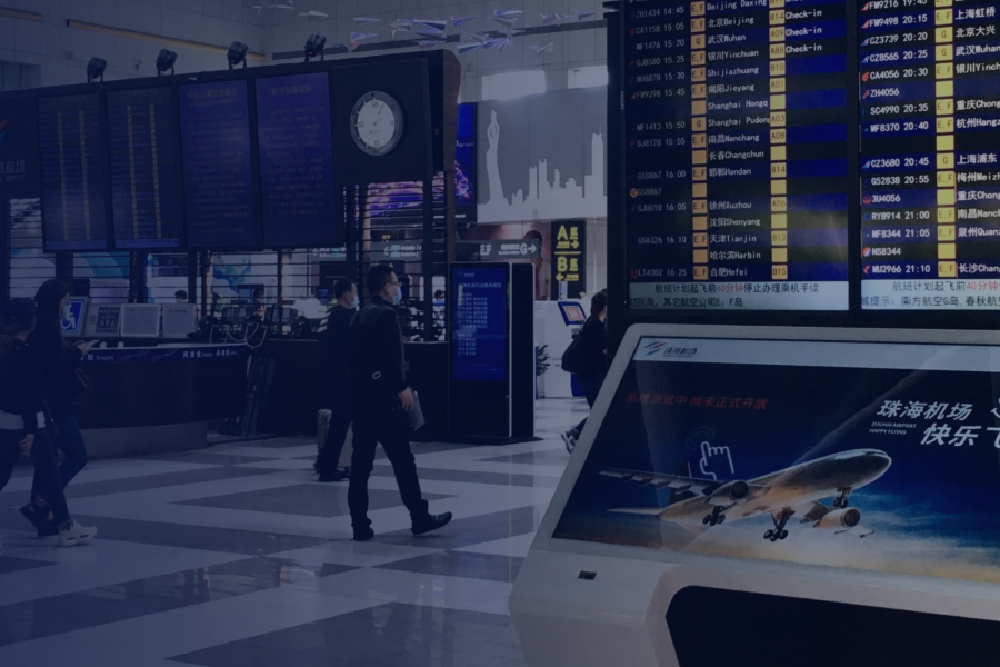 Interactive ViaDirect wayfinding kiosk at Zhuhai-Jinwan Airport, displaying real-time flight information and guiding passengers to key destinations.
