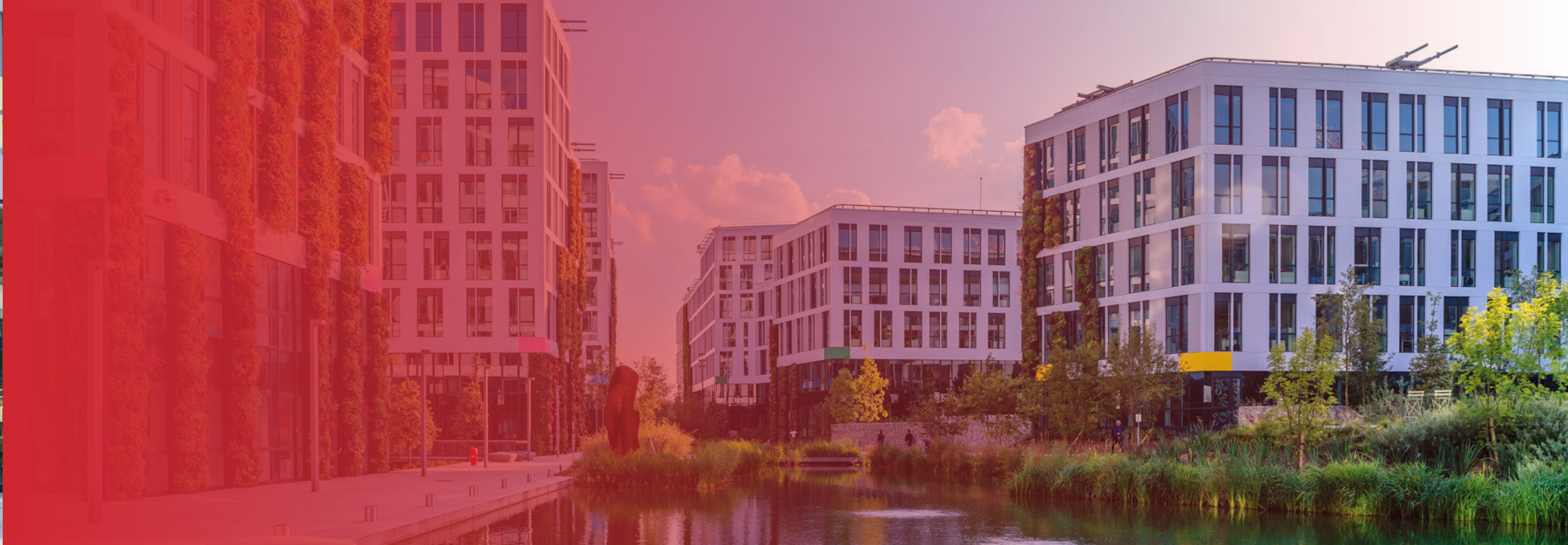 Exterior view of Orange Gardens campus, showcasing multiple buildings and a modern, expansive workspace environment.