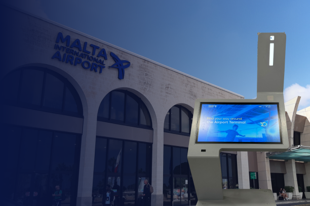 Interactive wayfinding kiosk by ViaDirect in front of Malta International Airport, enhancing passenger navigation with real-time information.