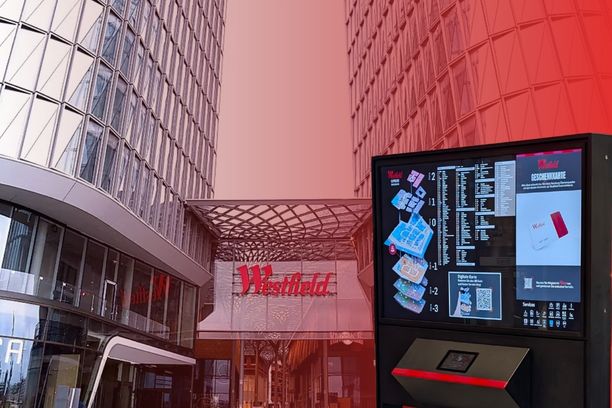 Interactive digital wayfinding kiosk at Westfield Überseequartier in Hamburg, helping visitors navigate the shopping center with a 3D map and directory