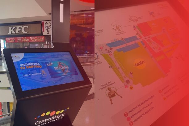 Side-by-side comparison image showing a black ViaDirect interactive digital kiosk on the left and a detailed close-up of an interactive 3D floor plan screen on the right with a subtle red gradient overlay.
